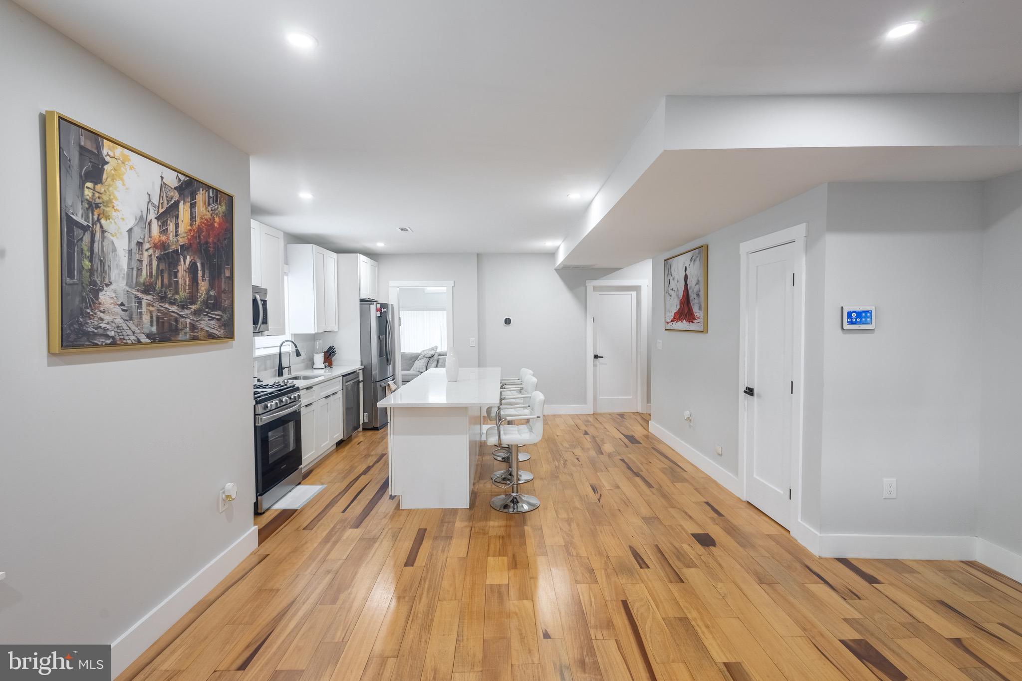 37 4th Street Laurel, MD 20707 - Photo 3 of 26 a living room with furniture and a painting on the wall