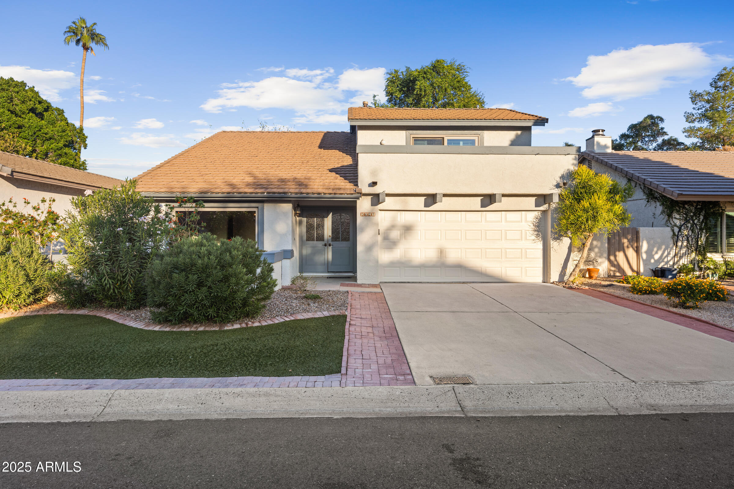 5627 South Crows Nest Road Tempe, AZ 85283 - Photo 1 of 93 a view of a house with a yard and potted plants