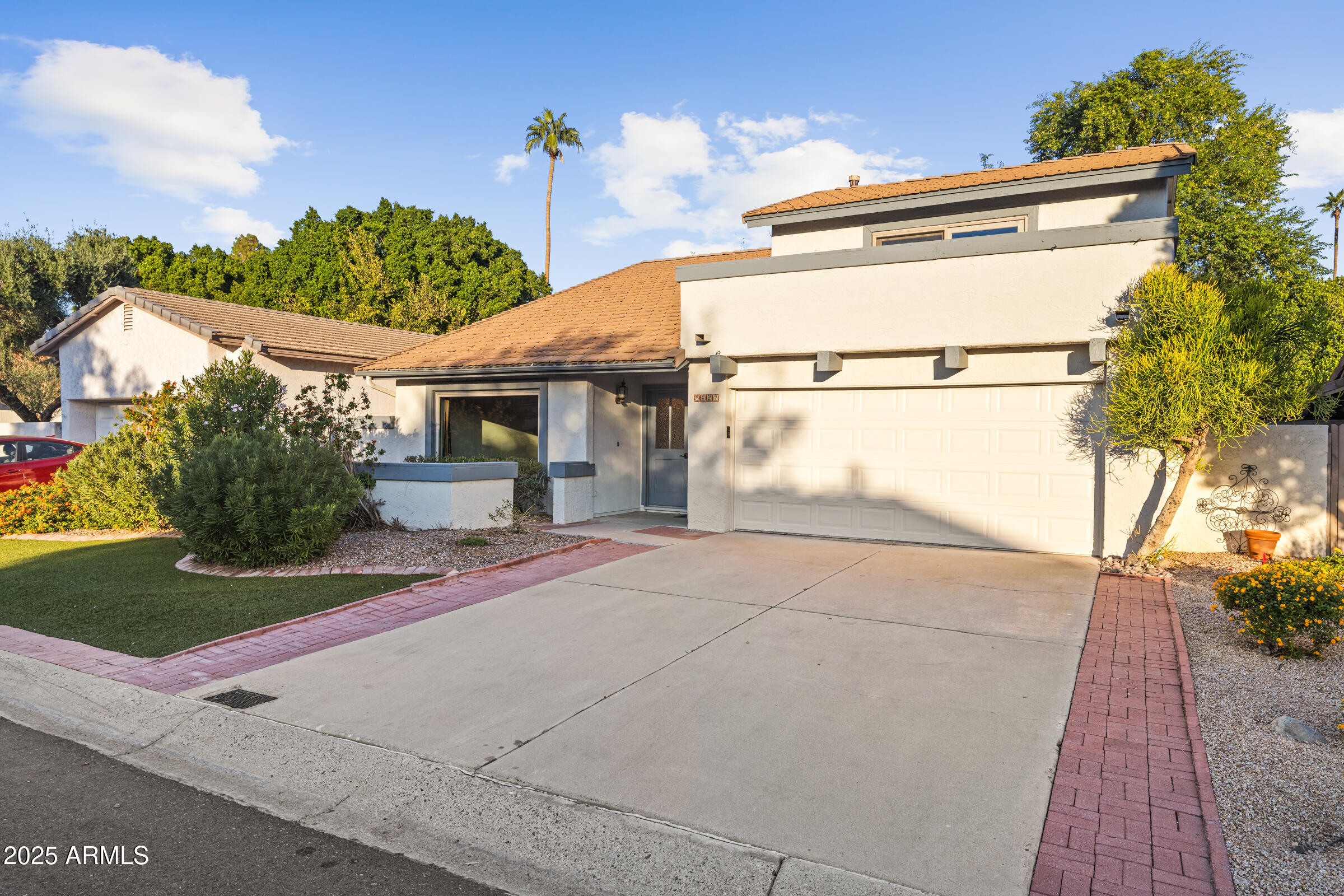 5627 South Crows Nest Road Tempe, AZ 85283 - Photo 2 of 93 a view of a house with a yard and plants