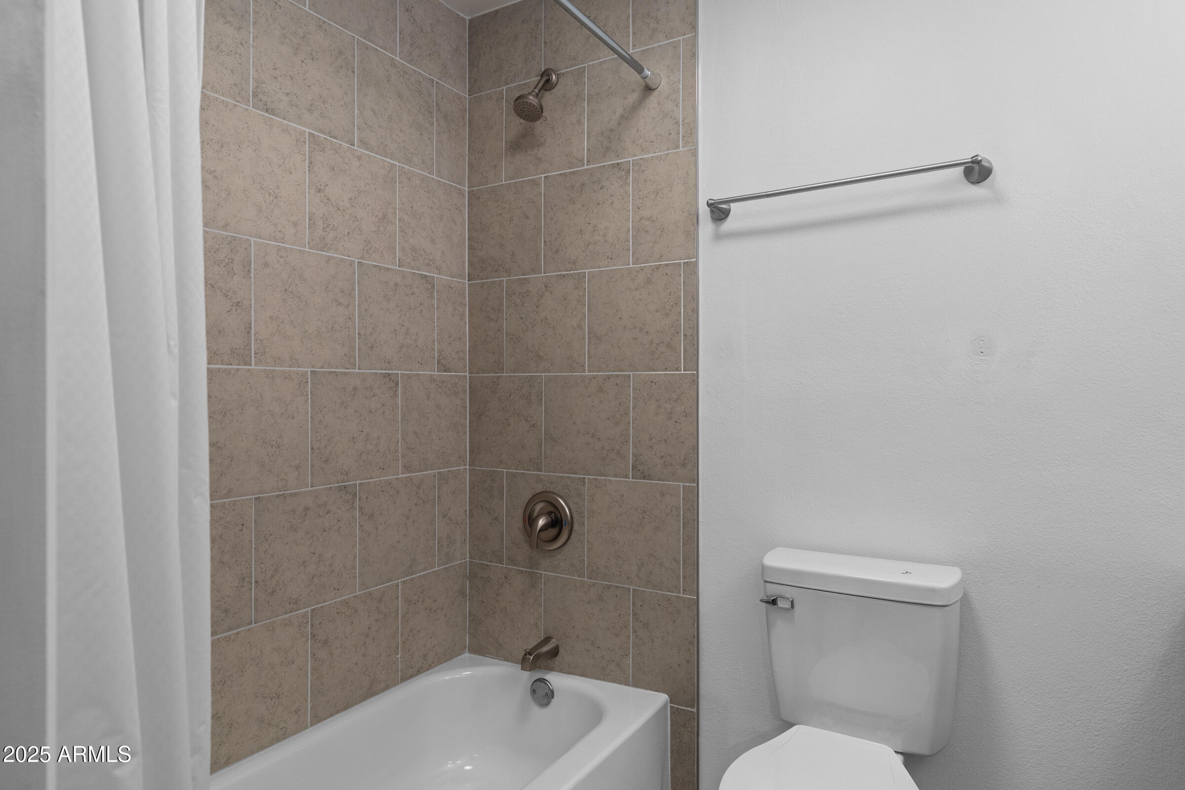 5627 South Crows Nest Road Tempe, AZ 85283 - Photo 25 of 93 a bathroom with a toilet and shower