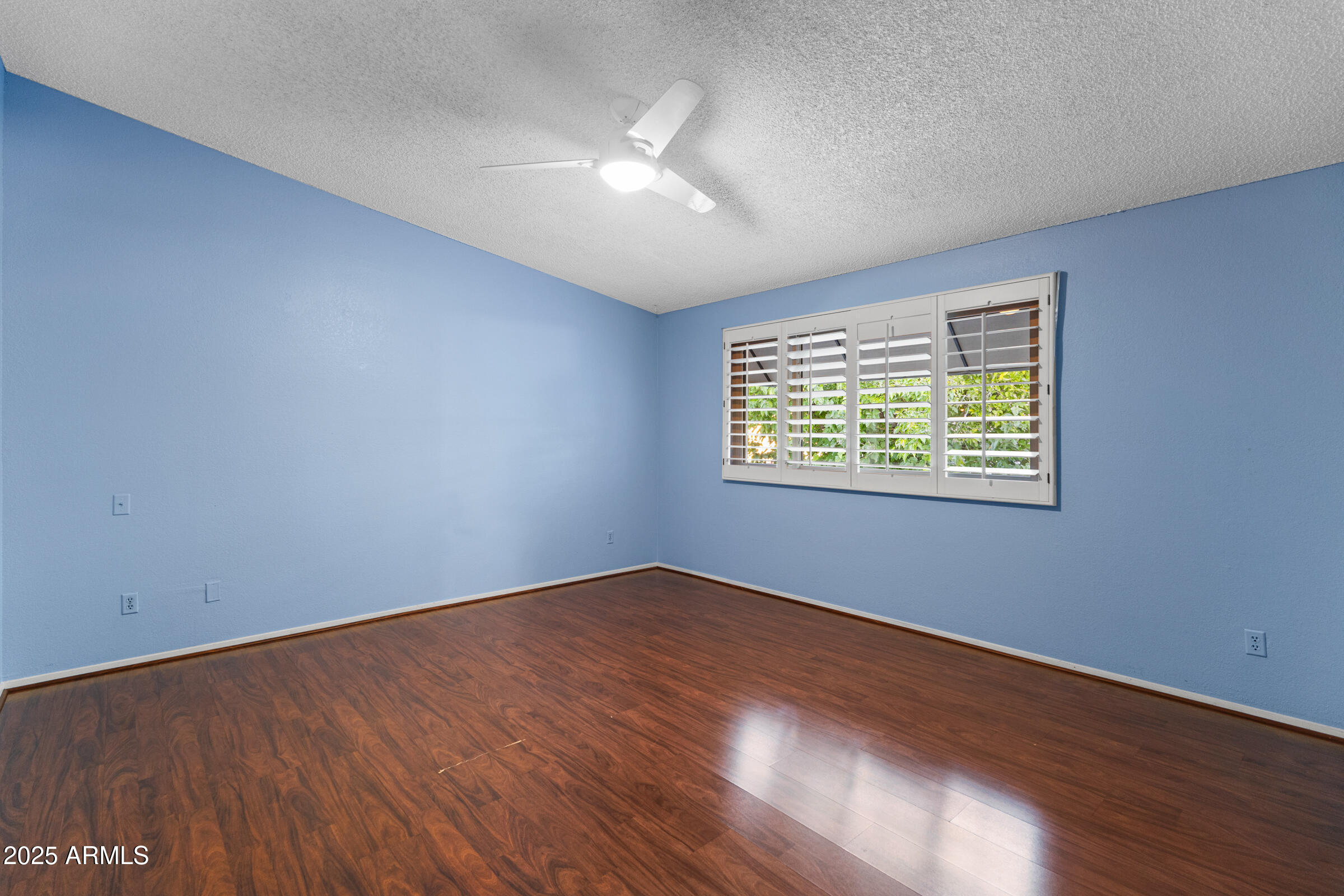 5627 South Crows Nest Road Tempe, AZ 85283 - Photo 30 of 93 an empty room with wooden floor and windows