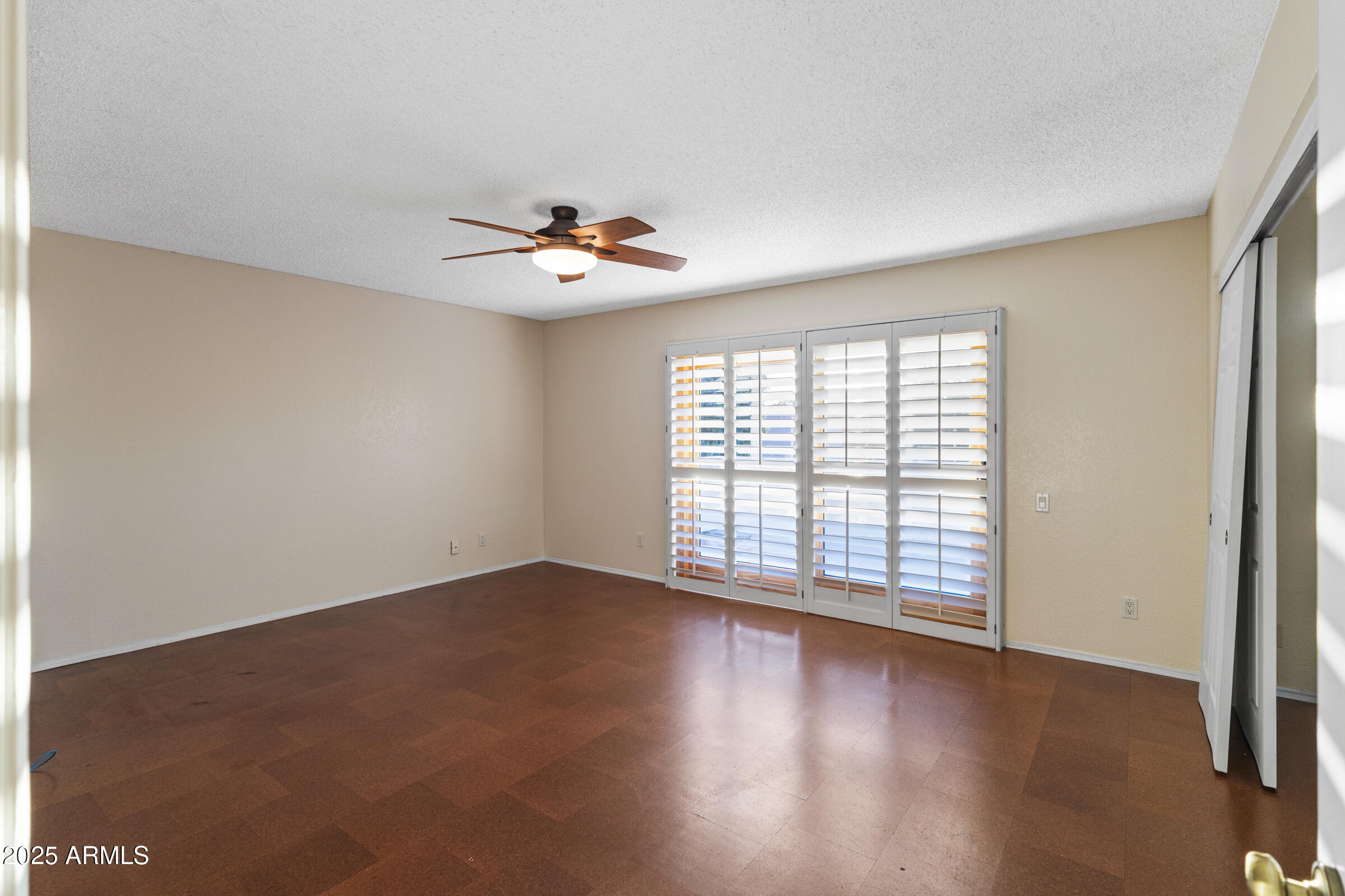 5627 South Crows Nest Road Tempe, AZ 85283 - Photo 32 of 93 an empty room with wooden floor and windows