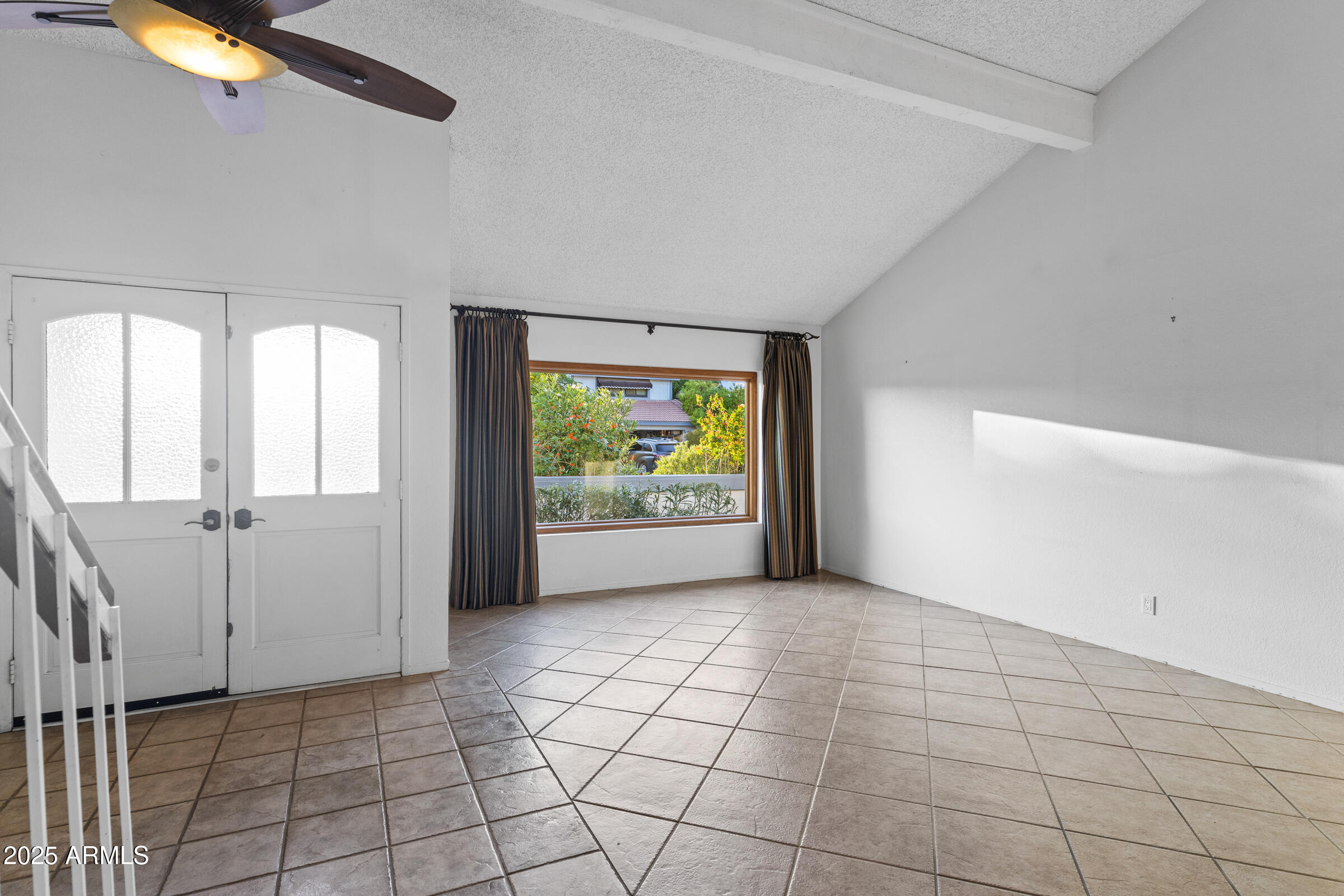5627 South Crows Nest Road Tempe, AZ 85283 - Photo 8 of 93 a view of an empty room with a window