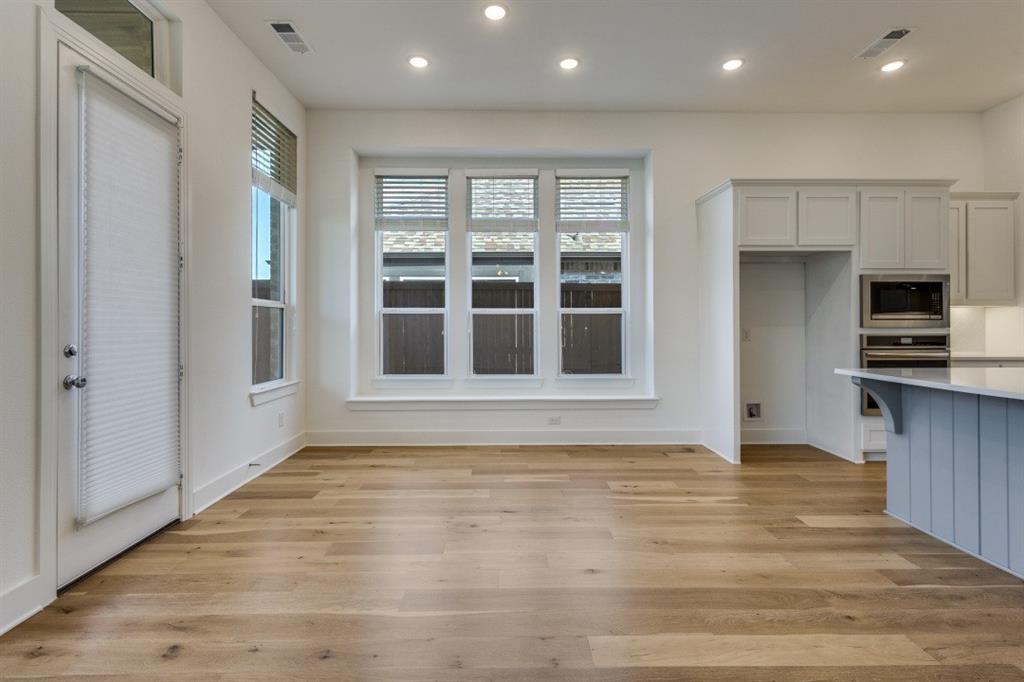 1704 Hydrangea Lane Prosper, TX 75078 - Photo 11 of 25 Unfurnished dining area featuring light wood finished floors, healthy amount of natural light, and recessed lighting