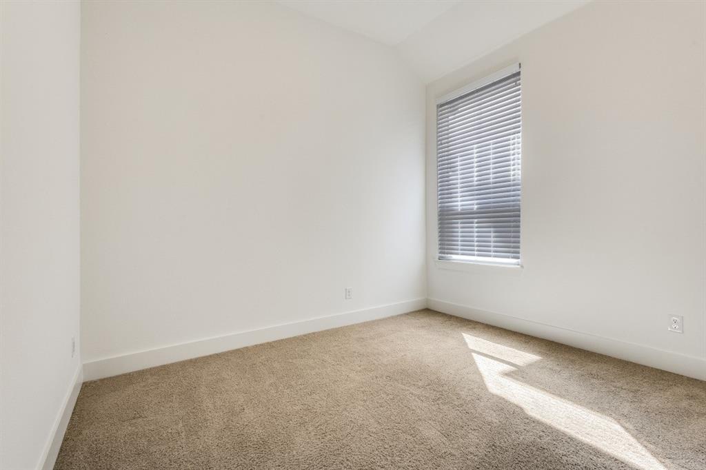 1704 Hydrangea Lane Prosper, TX 75078 - Photo 15 of 25 Carpeted spare room featuring baseboards and vaulted ceiling