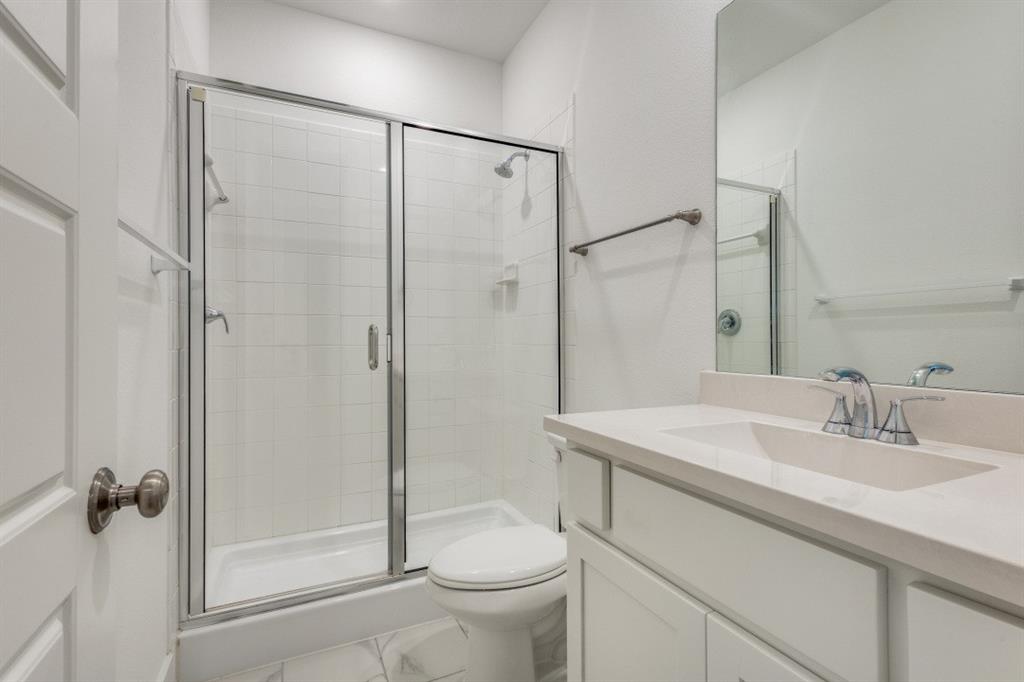 1704 Hydrangea Lane Prosper, TX 75078 - Photo 18 of 25 Bathroom with vanity and a stall shower