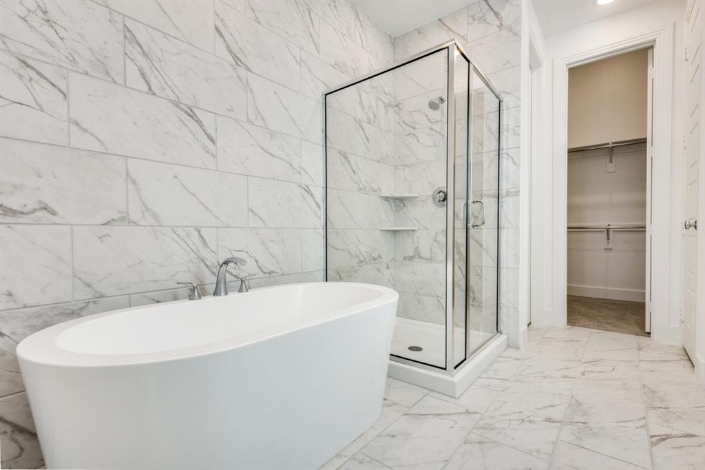 1704 Hydrangea Lane Prosper, TX 75078 - Photo 21 of 25 Full bathroom featuring a marble finish shower, a walk in closet, a soaking tub, marble finish floors, and tile walls