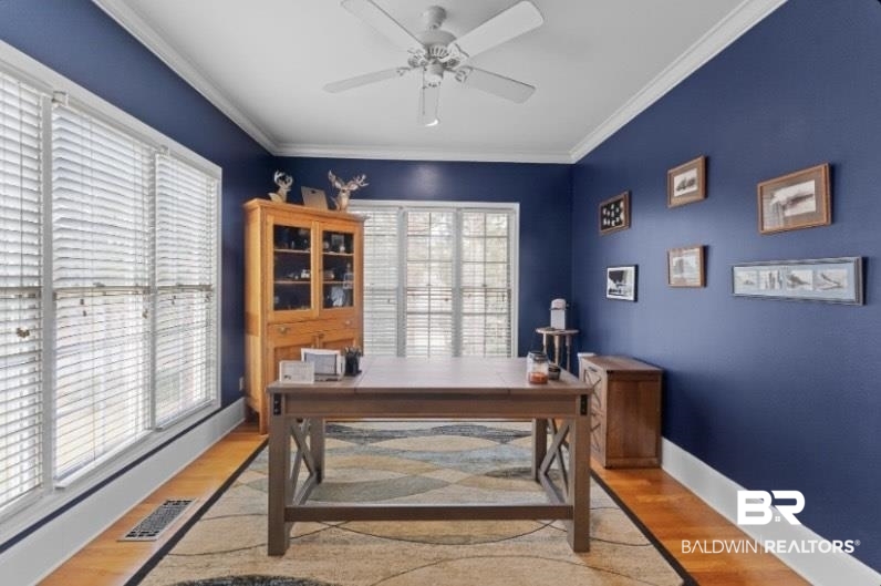 525 Norwood Road Monroeville, AL 36460 - Photo 20 of 55 Office with ornamental molding, light wood-style floors, plenty of natural light, and a ceiling fan