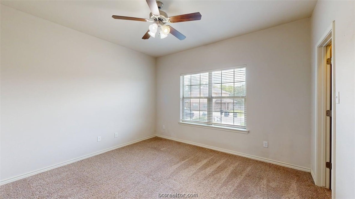 4453-4455 Reveille Road College Station, TX 77845 - Photo 30 of 37 an empty room with a window and a fan