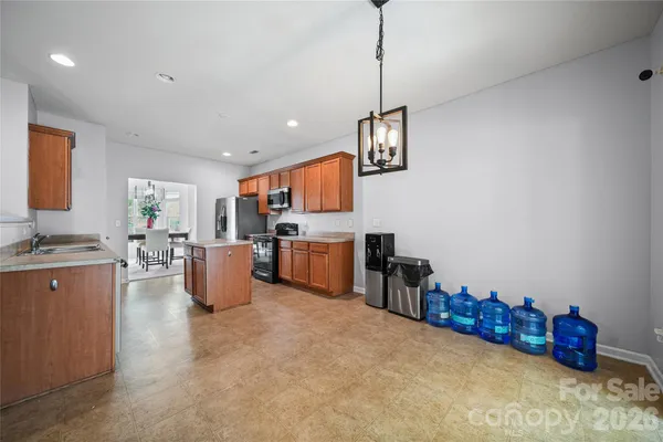 a kitchen with stainless steel appliances refrigerator and microwave