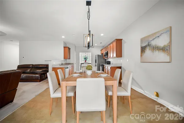 a dining room with furniture and window