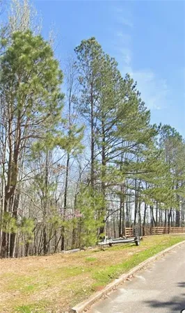 a view of a swimming pool with an outdoor space and seating area