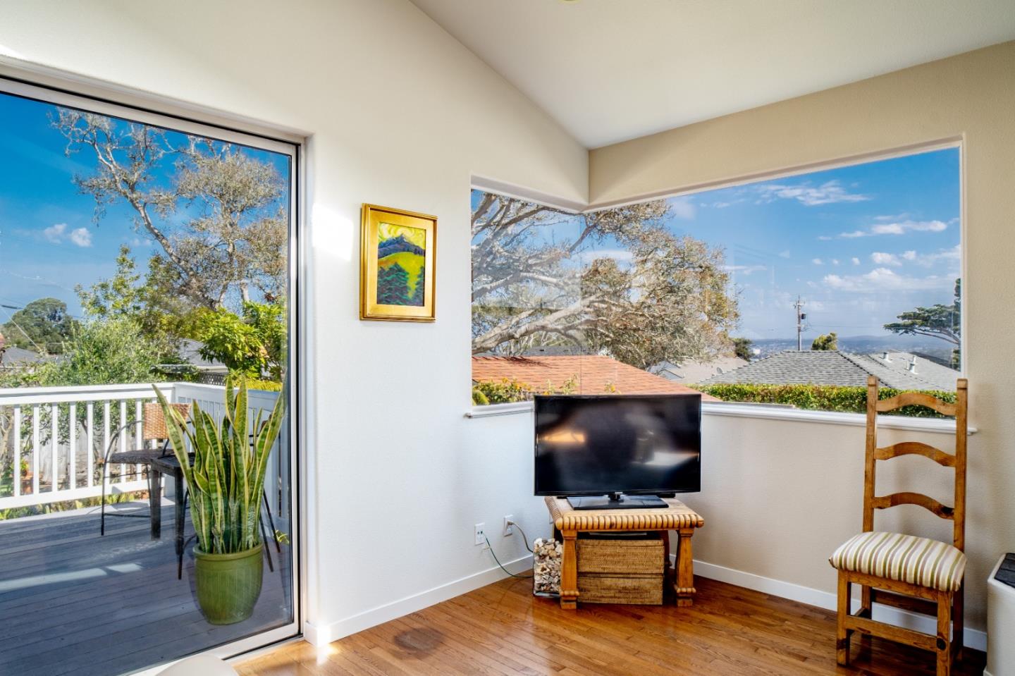 928 Hellam Street Monterey, CA 93940 - Photo 2 of 25 a living room with couch and a flat screen tv