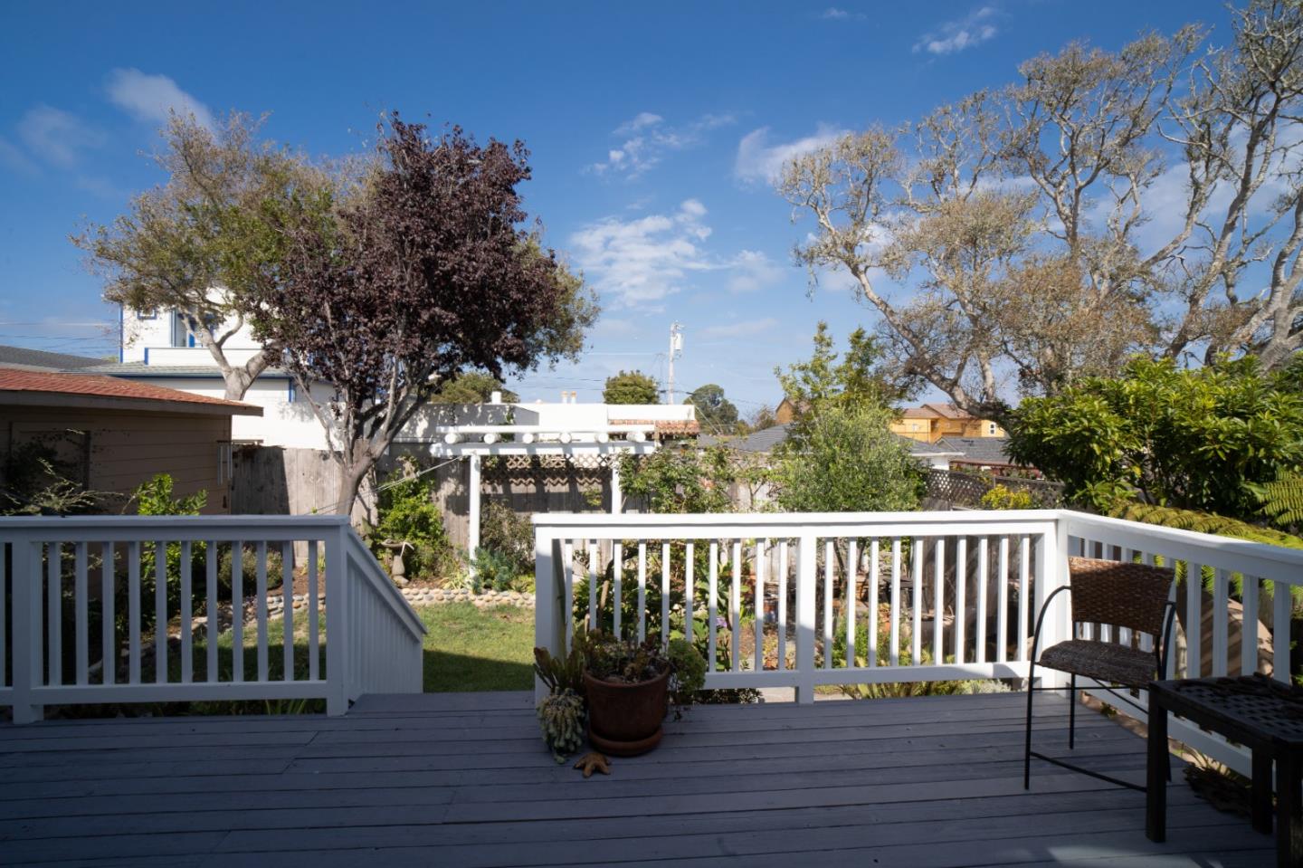 928 Hellam Street Monterey, CA 93940 - Photo 11 of 25 a view of balcony with wooden floor and outdoor seating