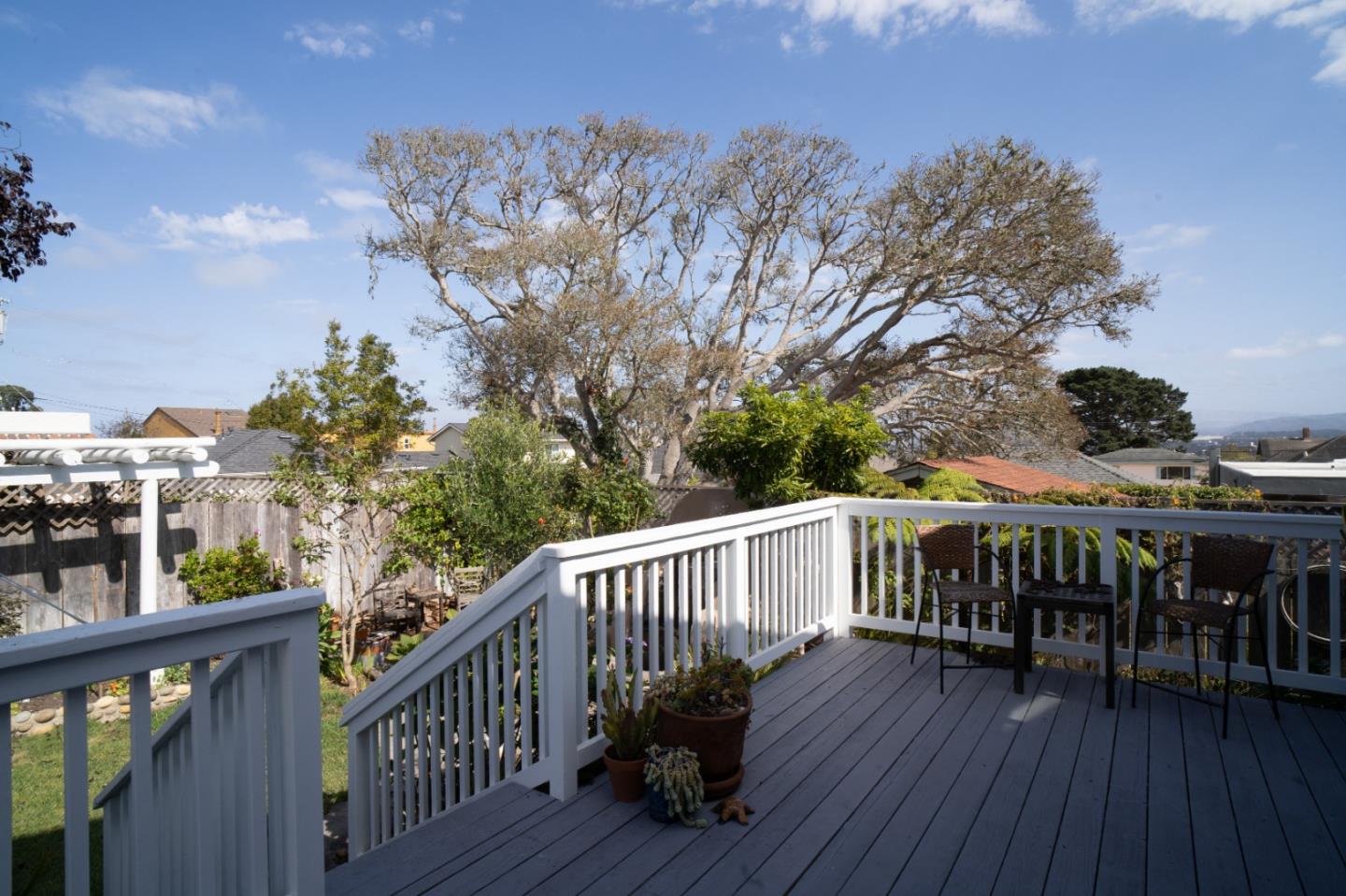 928 Hellam Street Monterey, CA 93940 - Photo 12 of 25 a view of a wooden deck and a yard