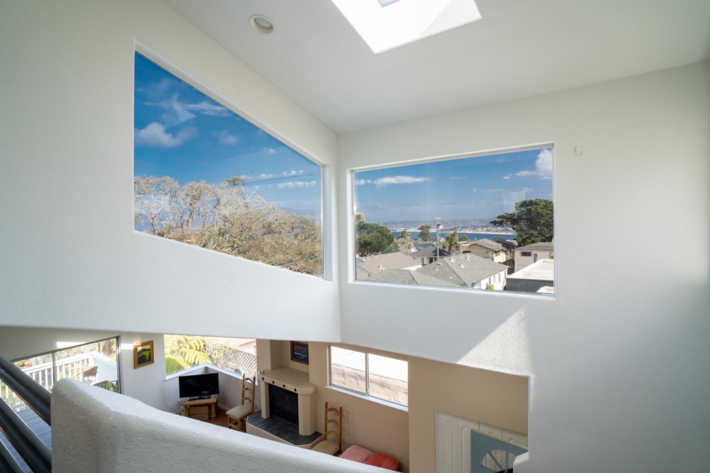 928 Hellam Street Monterey, CA 93940 - Photo 15 of 25 a view of a hallway with wooden floor and a bathroom