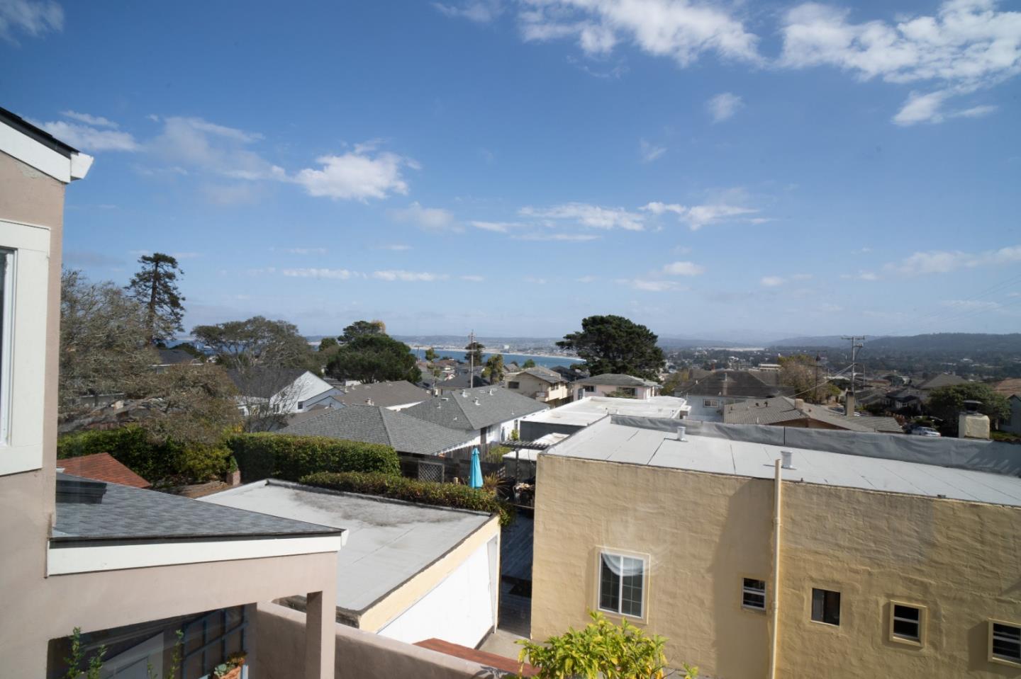 928 Hellam Street Monterey, CA 93940 - Photo 16 of 25 a view of a terrace with a table and chairs