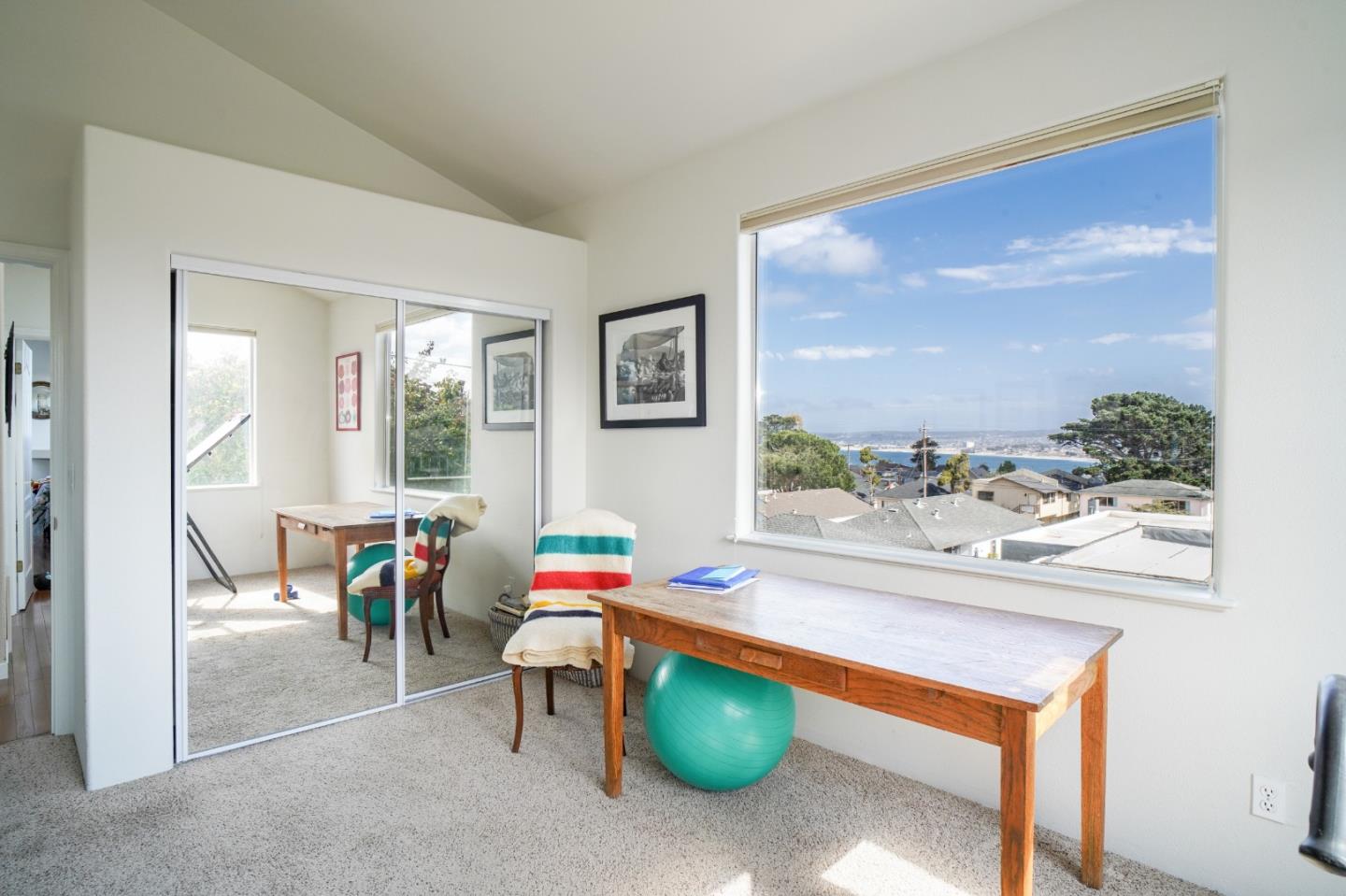 928 Hellam Street Monterey, CA 93940 - Photo 17 of 25 a dining room with furniture and a floor to ceiling window