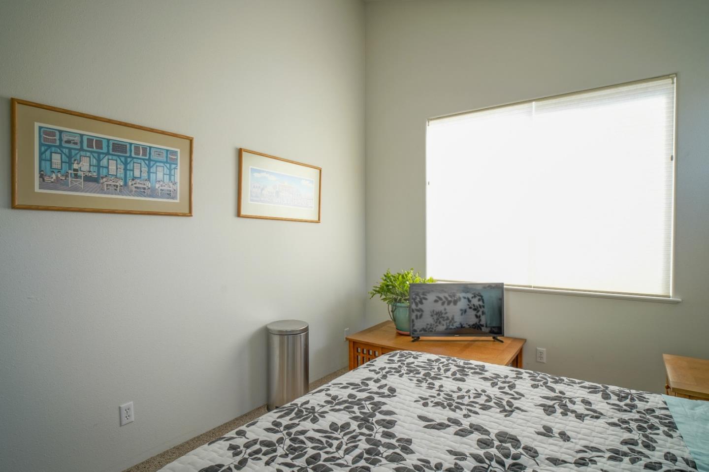 928 Hellam Street Monterey, CA 93940 - Photo 21 of 25 a bedroom with a bed and a window