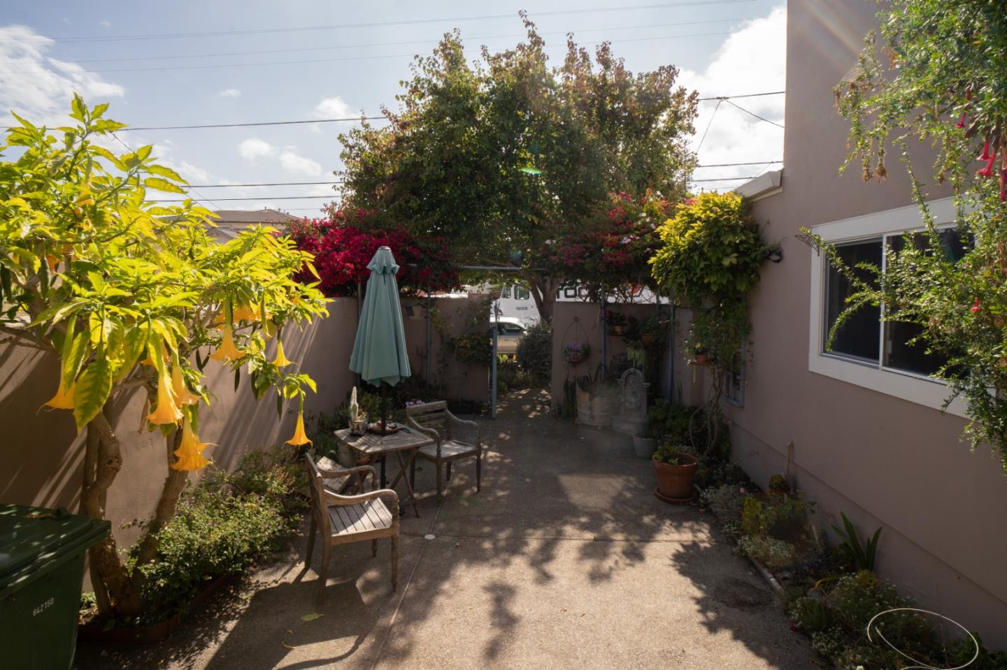 928 Hellam Street Monterey, CA 93940 - Photo 25 of 25 a view of backyard with plants and outdoor seating