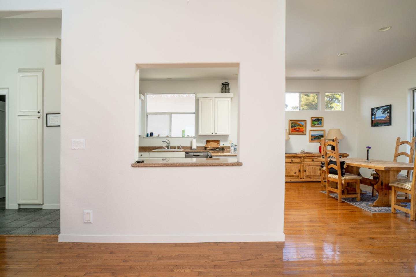 928 Hellam Street Monterey, CA 93940 - Photo 9 of 25 a view of a living room and kitchen with wooden floor