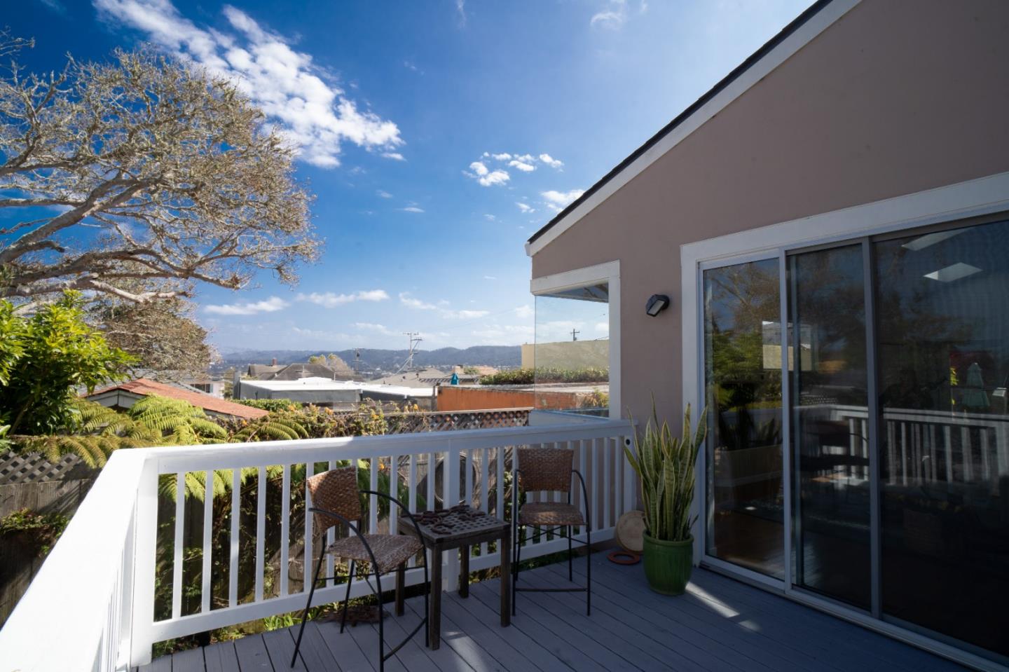928 Hellam Street Monterey, CA 93940 - Photo 10 of 25 a view of a balcony with furniture and wooden floor