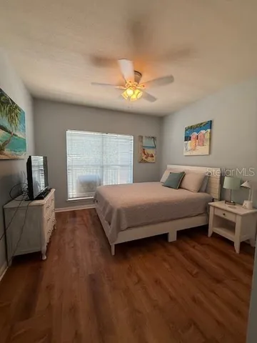 a bedroom with a bed and a couch