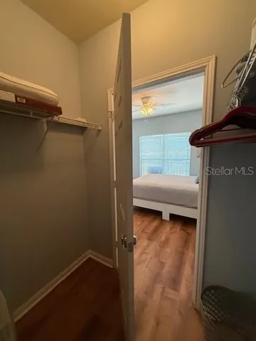 a view of a room that has a bed in it