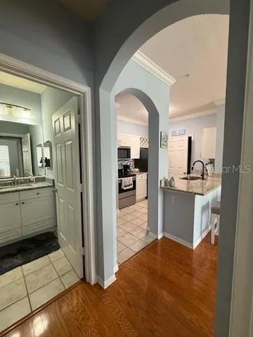 a view of a kitchen from the hallway