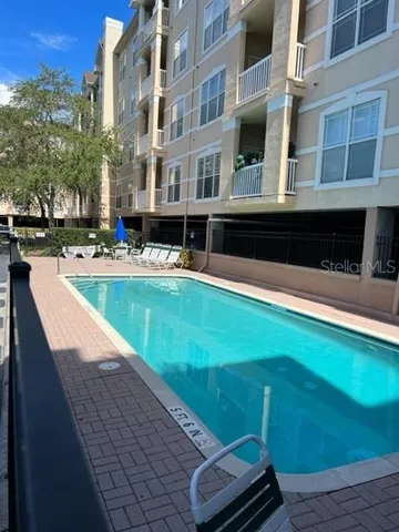 a view of a swimming pool with a lounge chairs