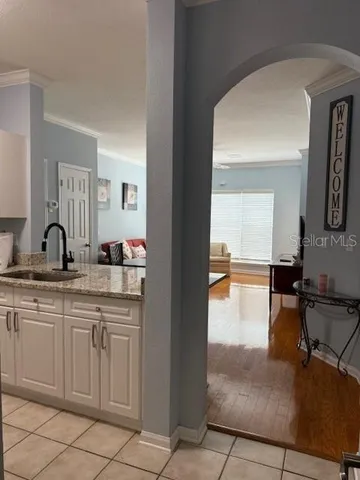 a spacious bathroom with a sink and a mirror