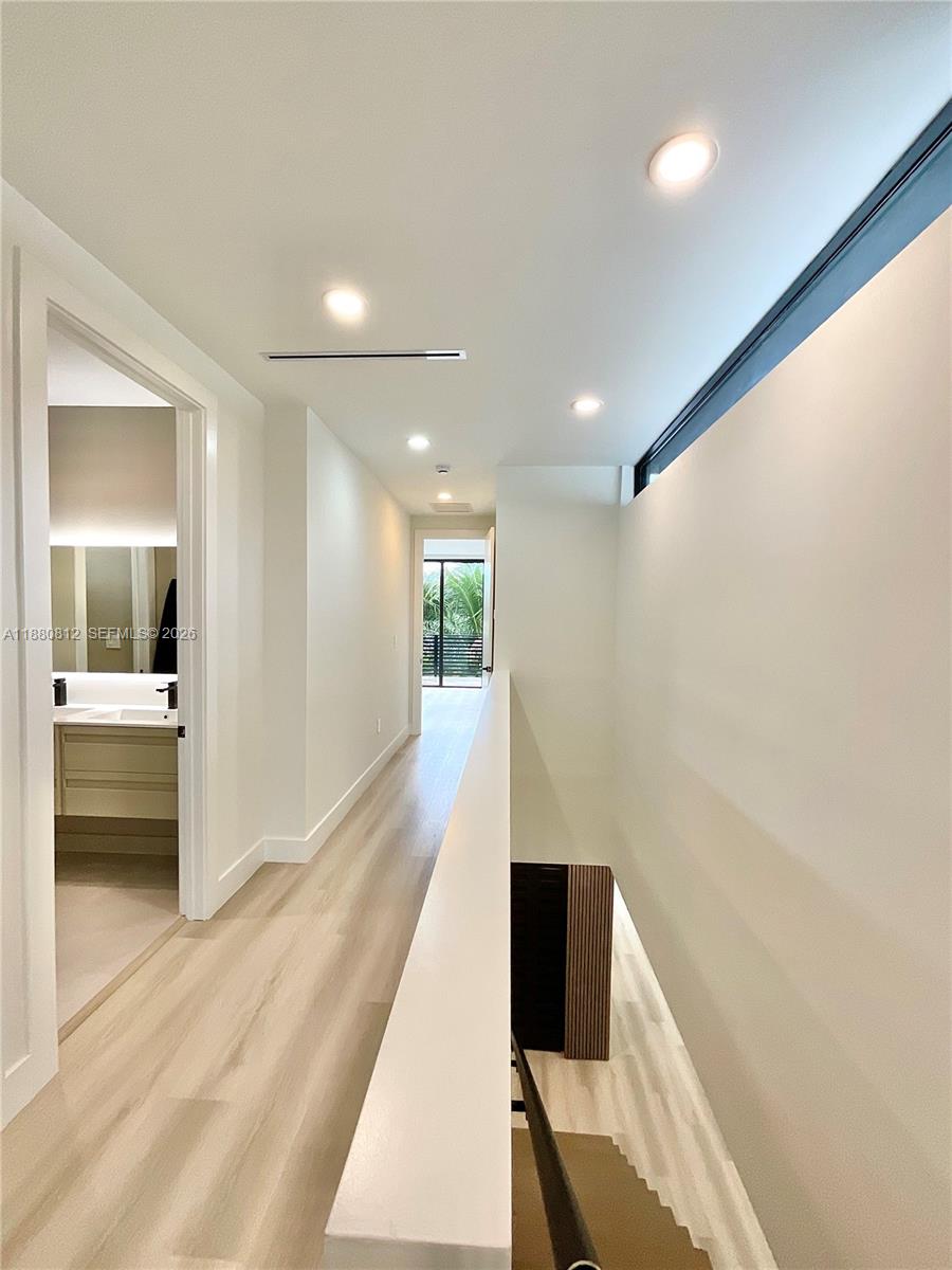 536 Northwest 48th Street Miami, FL 33127 - Photo 12 of 40 a bathroom with a sink and a large mirror