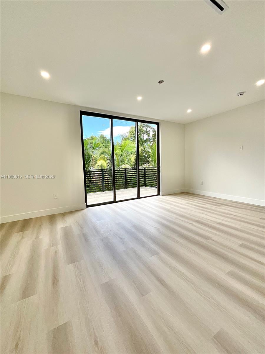 536 Northwest 48th Street Miami, FL 33127 - Photo 16 of 40 an empty room with large windows