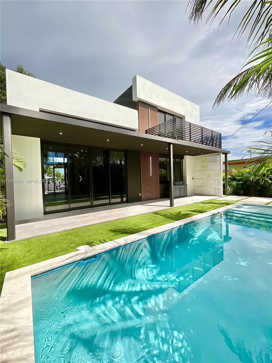 536 Northwest 48th Street Miami, FL 33127 - Photo 2 of 40 a view of swimming pool with small garden