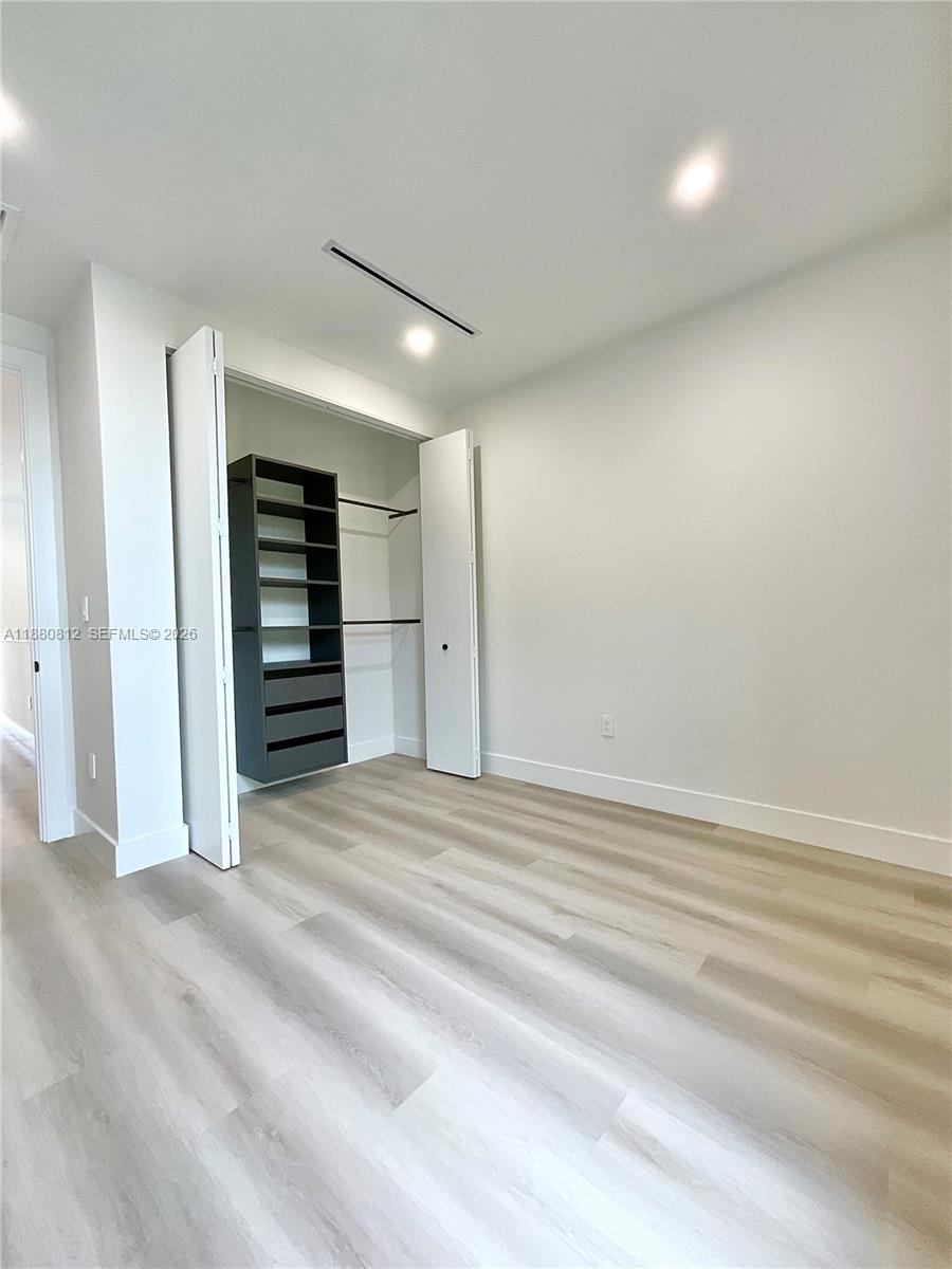 536 Northwest 48th Street Miami, FL 33127 - Photo 21 of 40 a view of empty room with a fireplace