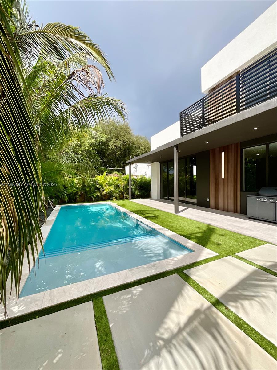 536 Northwest 48th Street Miami, FL 33127 - Photo 28 of 40 a view of a house with a yard