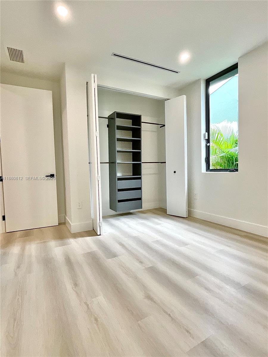536 Northwest 48th Street Miami, FL 33127 - Photo 10 of 40 a view of empty room with closet and natural light