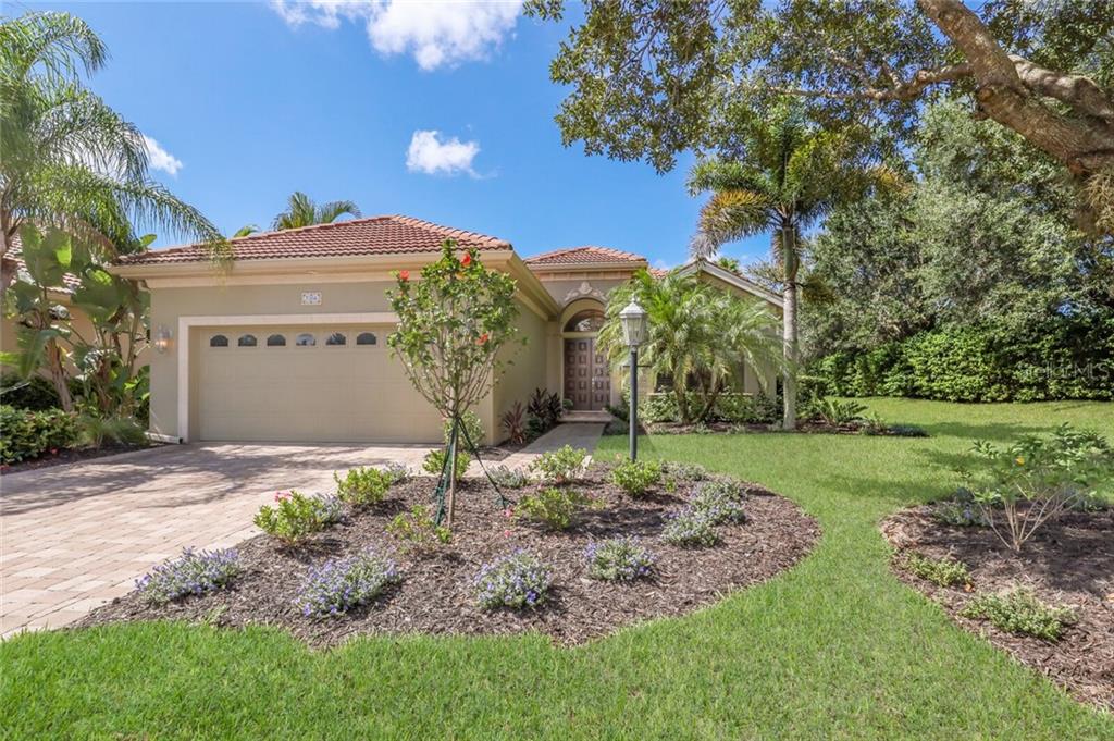 7308 Riviera Cove Lakewood Ranch, FL 34202 - Photo 1 of 1 Stunning Front view with lush landscaping