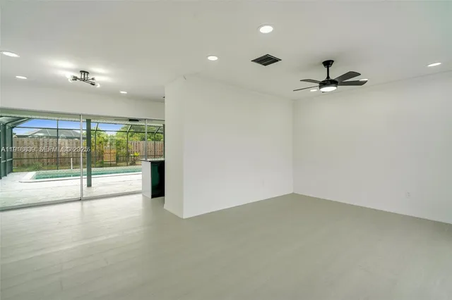 an empty room with fan