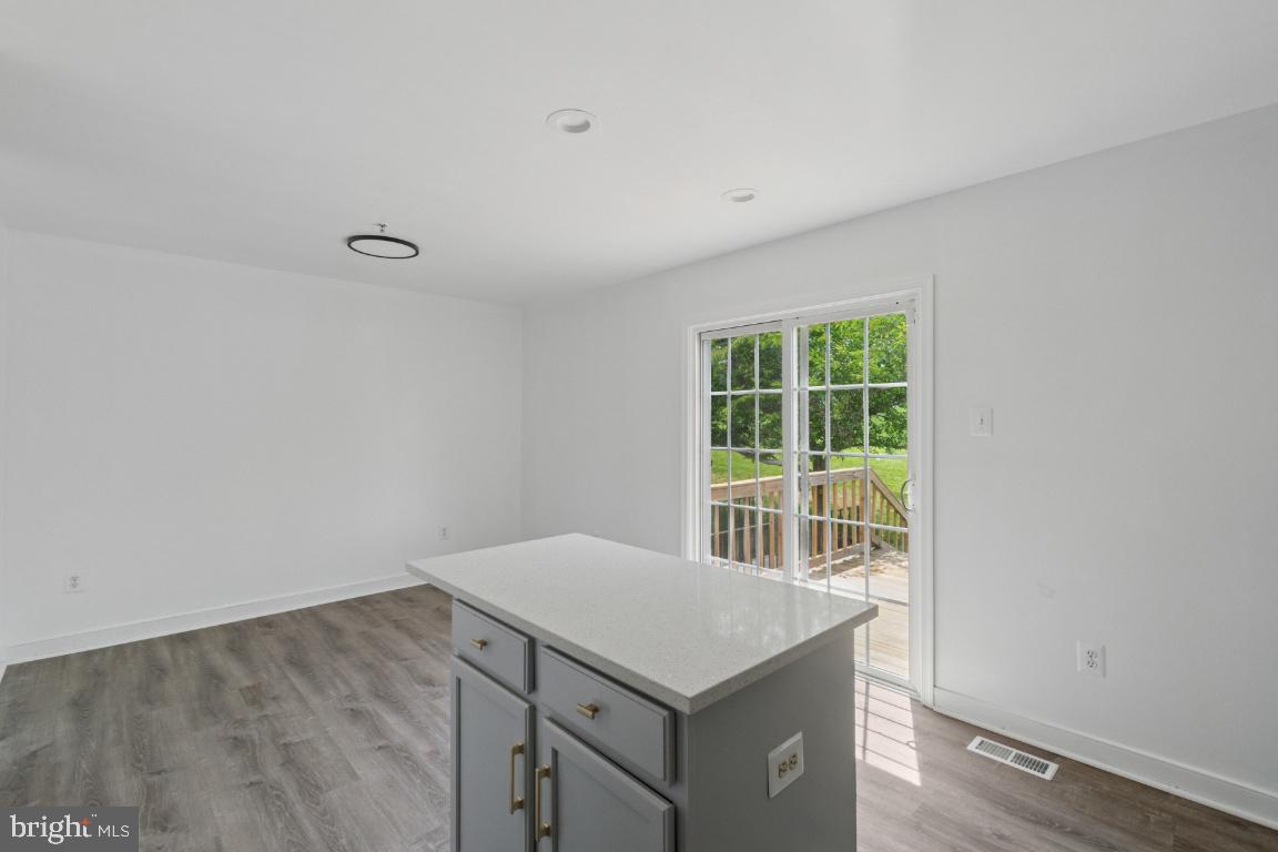 1109 Pomelo Court, Unit 1109 Baltimore, MD 21228 - Photo 12 of 40 an empty room with a window