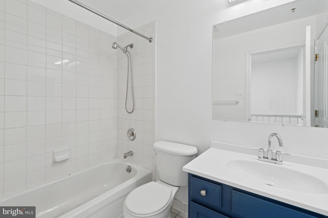 1109 Pomelo Court, Unit 1109 Baltimore, MD 21228 - Photo 18 of 40 a bathroom with a sink a toilet and shower