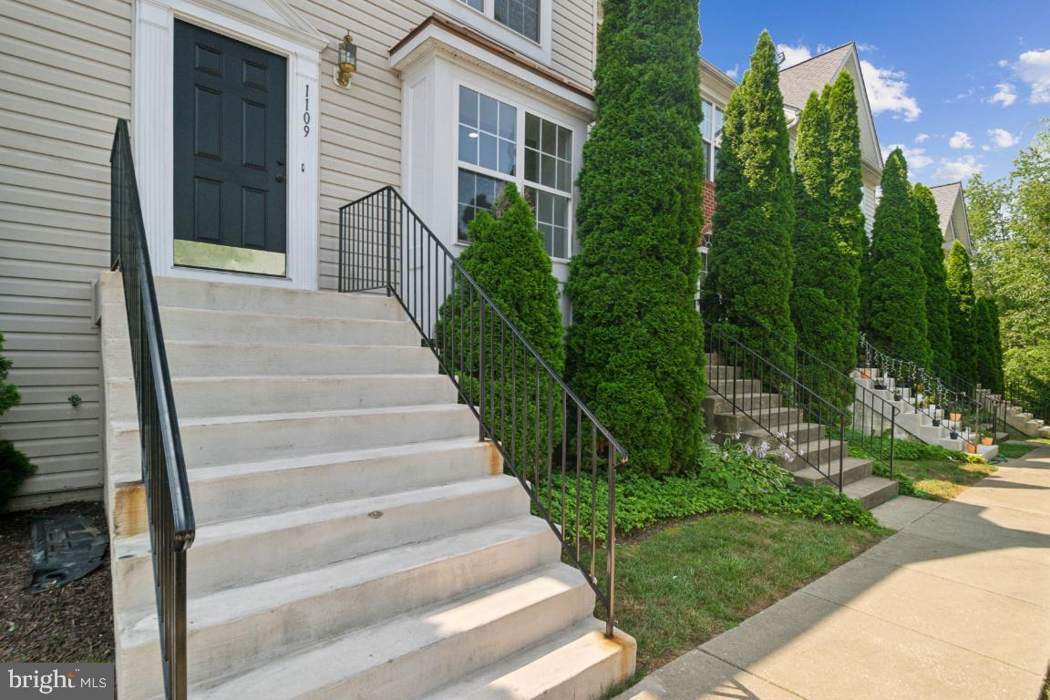 1109 Pomelo Court, Unit 1109 Baltimore, MD 21228 - Photo 2 of 40 a view of a house with a yard