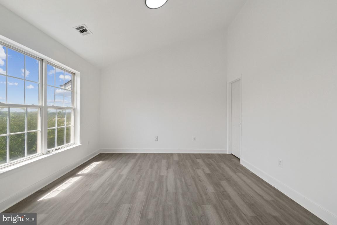 1109 Pomelo Court, Unit 1109 Baltimore, MD 21228 - Photo 22 of 40 a view of wooden floor in a room