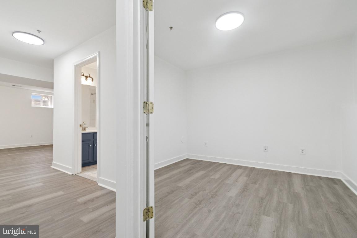 1109 Pomelo Court, Unit 1109 Baltimore, MD 21228 - Photo 28 of 40 wooden floor in an empty room