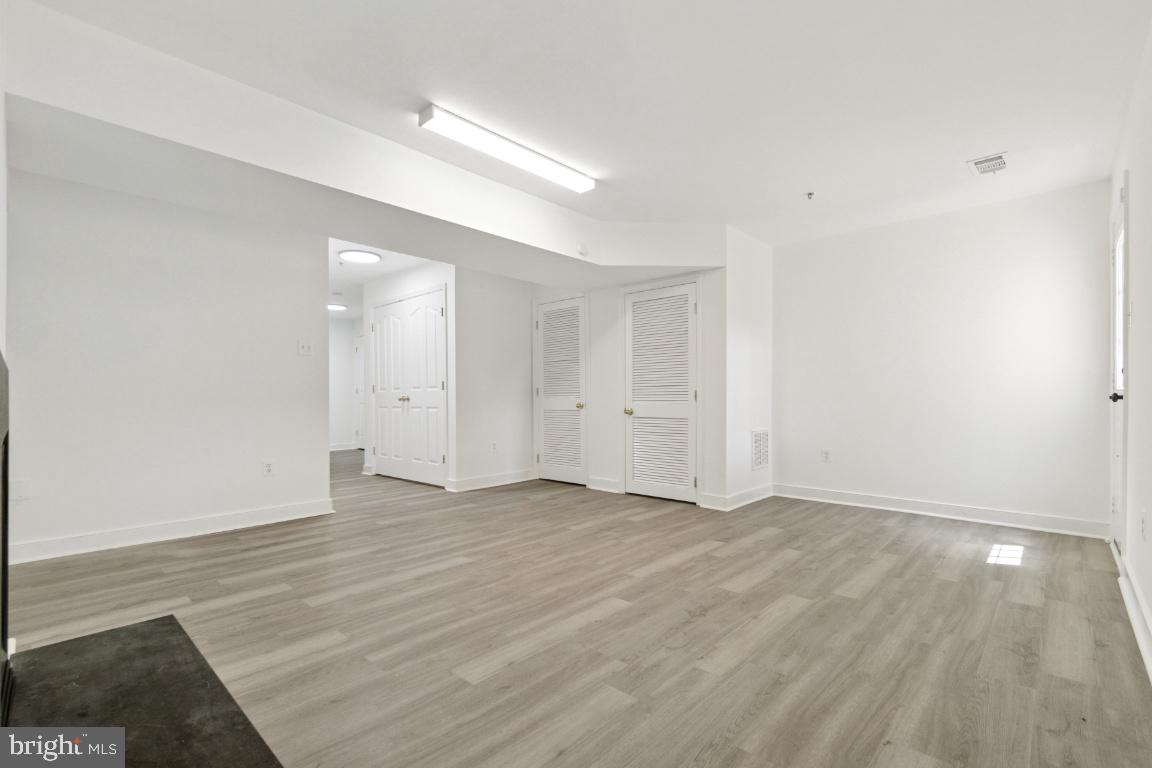 1109 Pomelo Court, Unit 1109 Baltimore, MD 21228 - Photo 35 of 40 wooden floor in an empty room