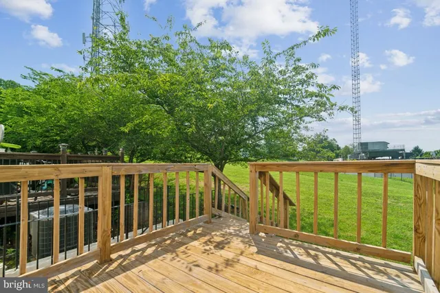 a view of a balcony with wooden floor