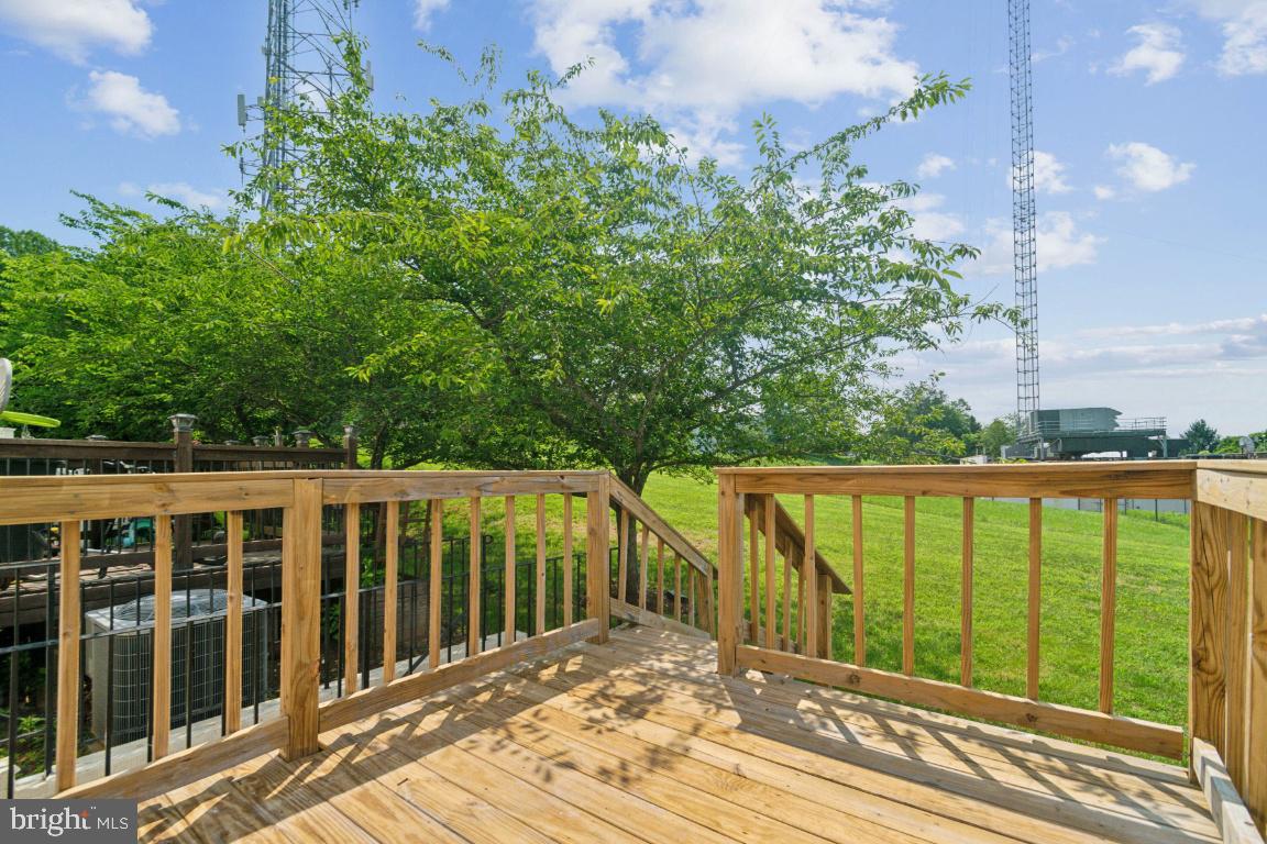 1109 Pomelo Court, Unit 1109 Baltimore, MD 21228 - Photo 37 of 40 a view of a balcony with wooden floor