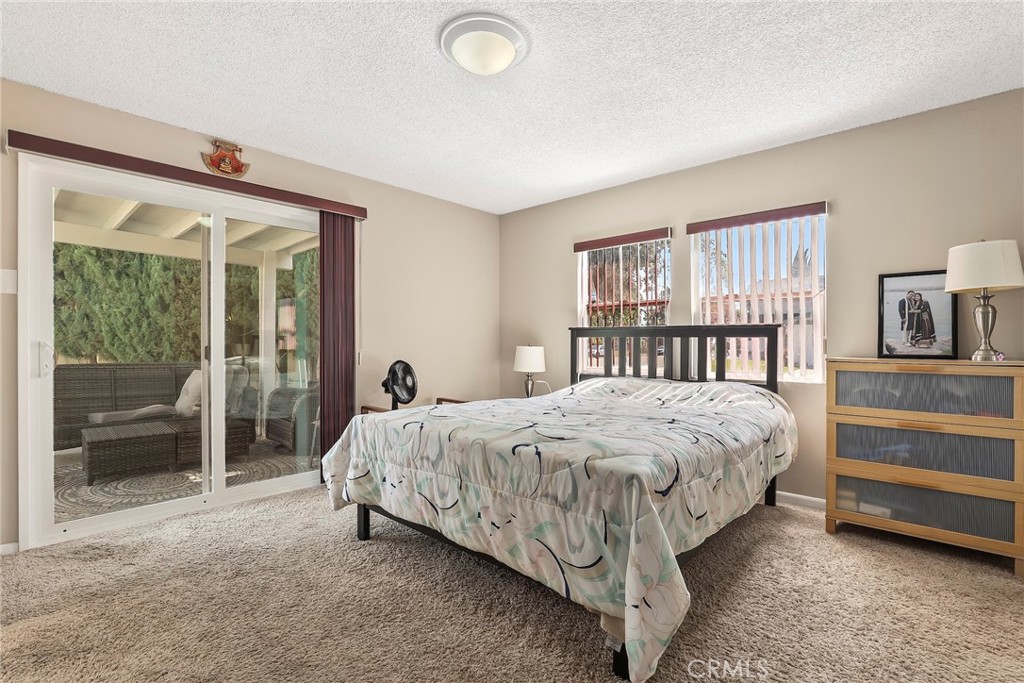 19709 Strathern Street Winnetka, CA 91306 - Photo 14 of 31 a bed sitting in a bedroom next to a window