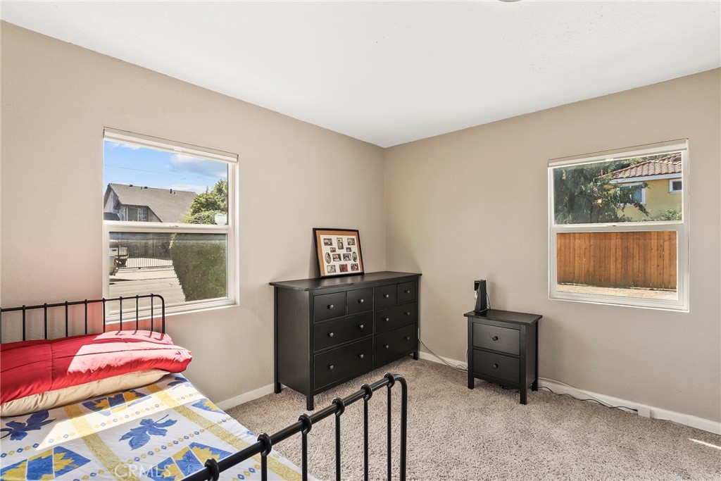 19709 Strathern Street Winnetka, CA 91306 - Photo 17 of 31 a bedroom with a bed and a window