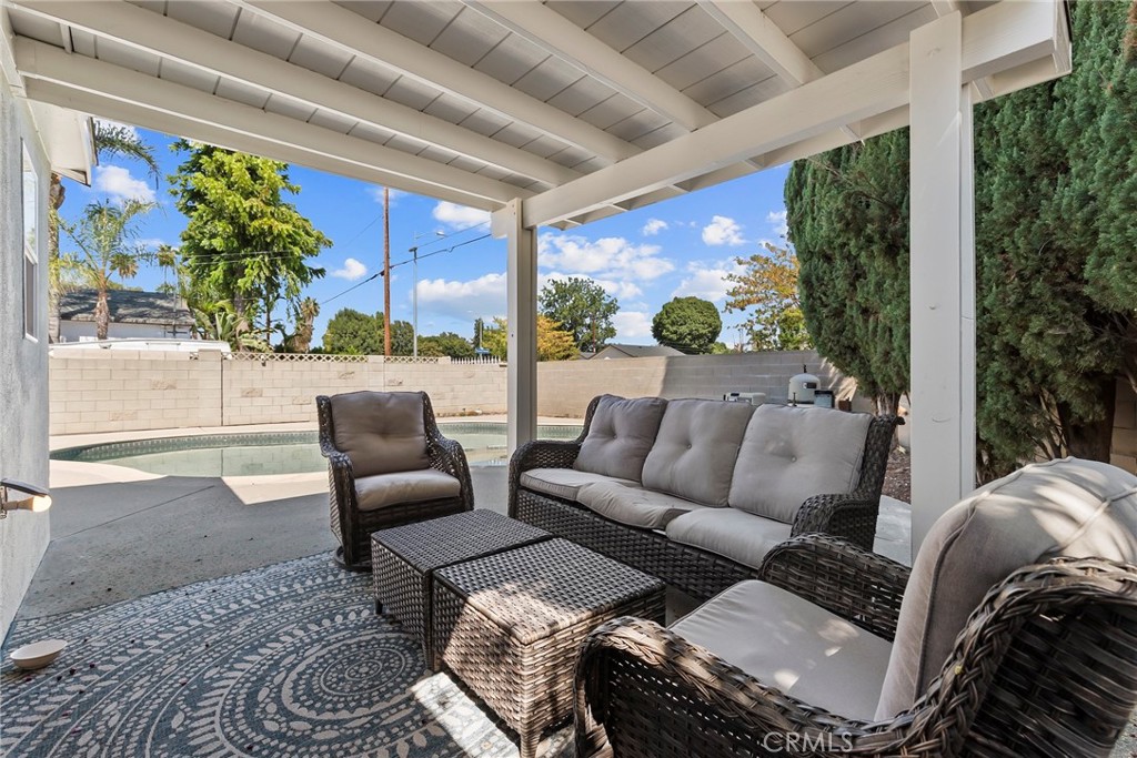 19709 Strathern Street Winnetka, CA 91306 - Photo 23 of 31 a living room with furniture and a potted plant
